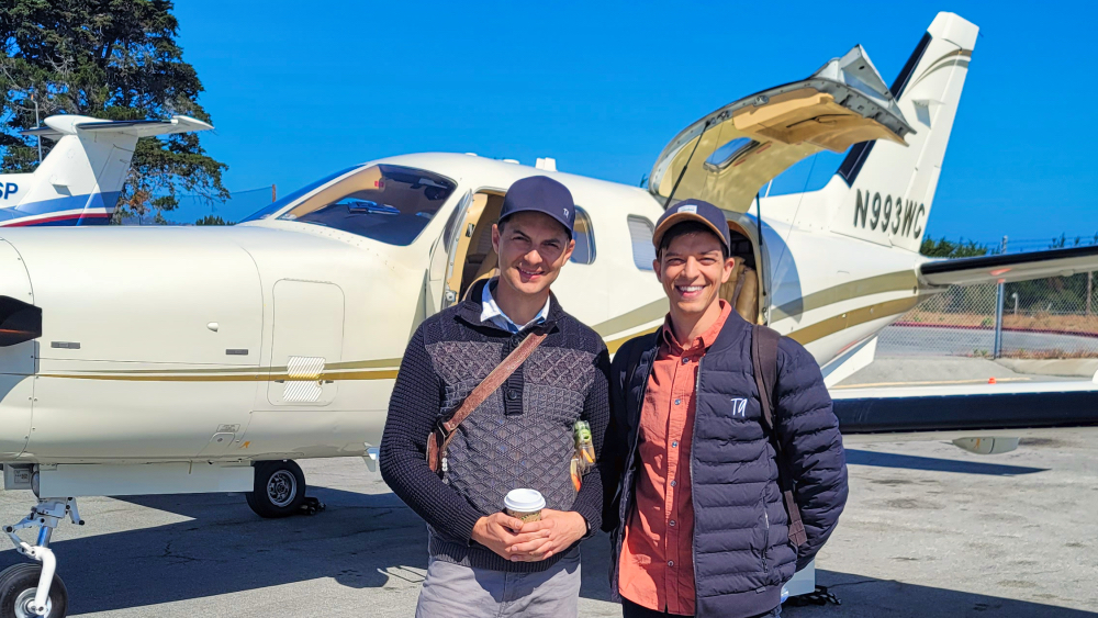 Mike Buffo and Billy Schmidt in front of Tim Allen's private plane